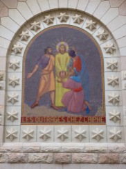 colorful mosaic of Jesus with his hands bound, surrounded by three men